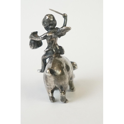 217 - A miniature fully hallmarked sterling silver figure of a cherub upon a pig, assay marked for Chester... 