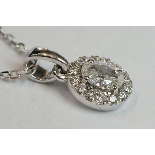 241 - 18ct White Gold Diamond Pendant of 25 points approx. total on gold chain