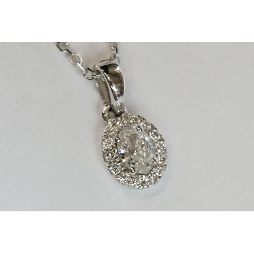 241 - 18ct White Gold Diamond Pendant of 25 points approx. total on gold chain