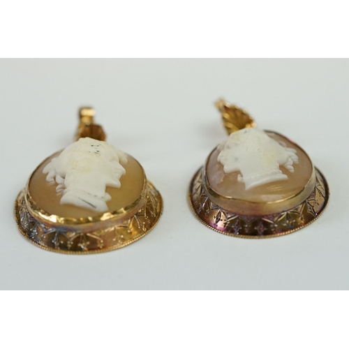 243 - A pair of yellow metal cameo earrings.