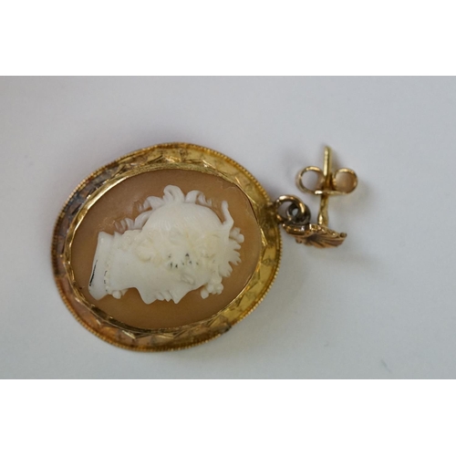 243 - A pair of yellow metal cameo earrings.