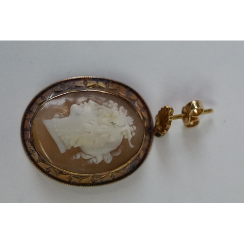 243 - A pair of yellow metal cameo earrings.