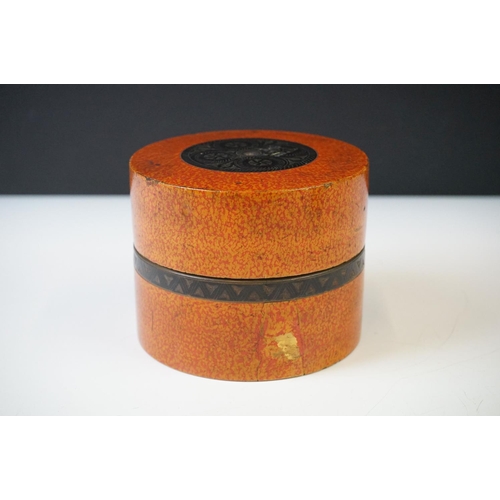 227 - A Nest of seven Indian boxes with orange lacquer decoration.