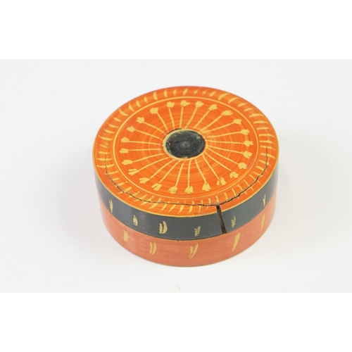 227 - A Nest of seven Indian boxes with orange lacquer decoration.