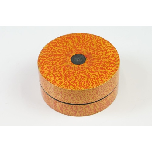 227 - A Nest of seven Indian boxes with orange lacquer decoration.