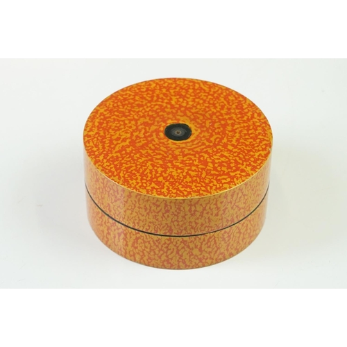 227 - A Nest of seven Indian boxes with orange lacquer decoration.