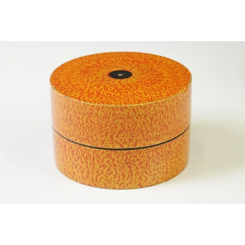 227 - A Nest of seven Indian boxes with orange lacquer decoration.