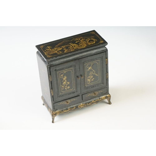 269 - A collection of ebonised Chinese dolls house furniture to include screen, tables, stools...etc.