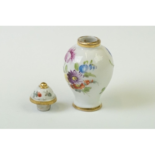 278 - A miniature hand painted porcelain lidded vase, marked Dresden to base.