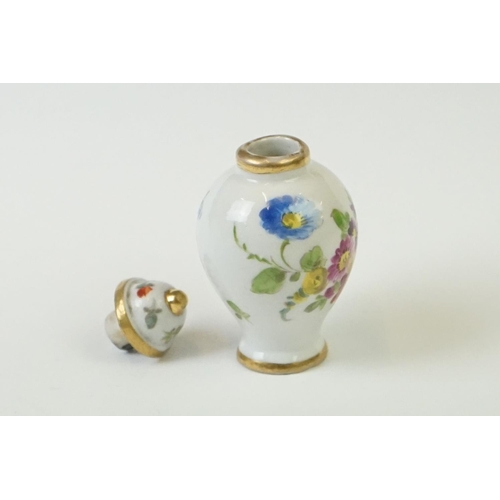 278 - A miniature hand painted porcelain lidded vase, marked Dresden to base.