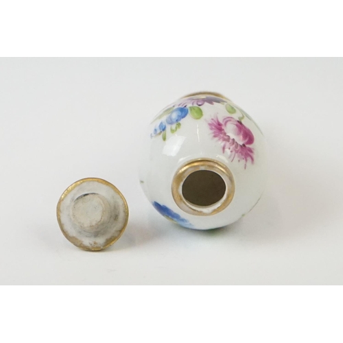 278 - A miniature hand painted porcelain lidded vase, marked Dresden to base.