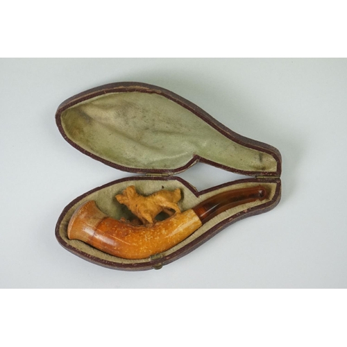 279 - An antique meerschaum pipe with carved dog within original fitted case.