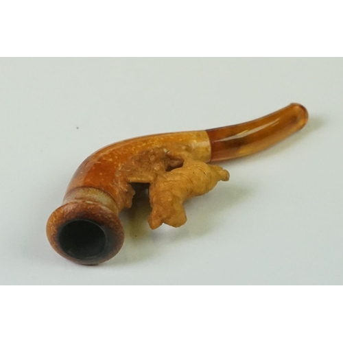 279 - An antique meerschaum pipe with carved dog within original fitted case.