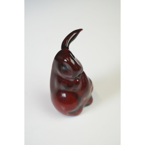 281 - A Royal Doulton Flambe one eared rabbit ceramic figure, stands approx 6cm in height.