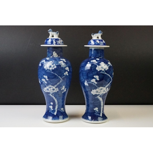 298 - Pair of Chinese Blue and White vases & covers, of inverted baluster form, with flowering prunus tree... 