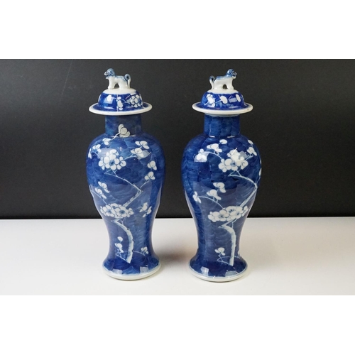 298 - Pair of Chinese Blue and White vases & covers, of inverted baluster form, with flowering prunus tree... 