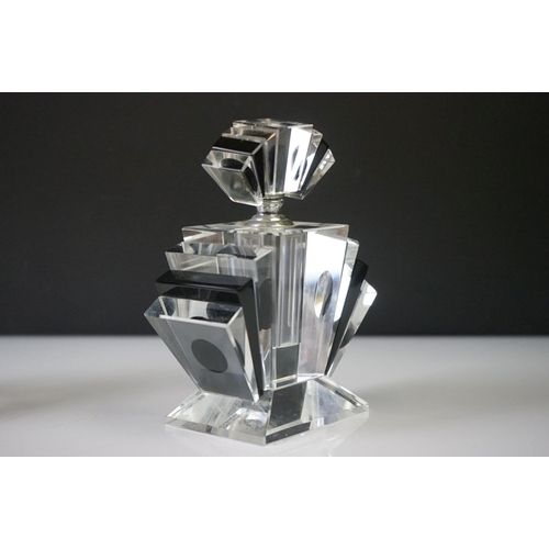 39 - Two Art Deco style scent bottles of geometric form. Each stands approx 15cm in height.