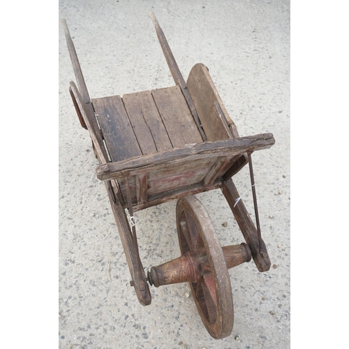 97 - Traditional Wooden Wheelbarrow with through jointed frame, wooden spoke wheel with iron rim and remo... 