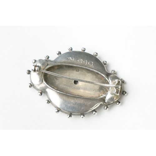 70 - A fully hallmarked sterling silver mourning brooch with rose and yellow gold decoration, assay marke... 