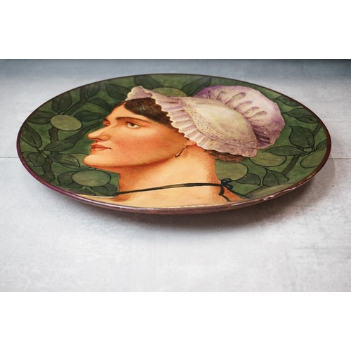 136 - Late 19th Century Doulton Lambeth Charger hand painted with the portrait of a woman, JC monogram to ... 