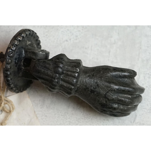 156 - Cast Iron Door Knocker and Striker modelled as a hand & orb (knocker measures approx 12.5cm long)