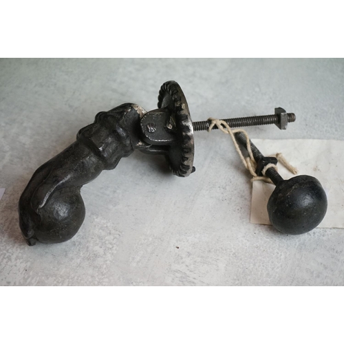 156 - Cast Iron Door Knocker and Striker modelled as a hand & orb (knocker measures approx 12.5cm long)