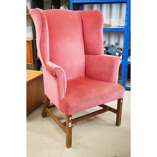 592 - Edwardian Wingback Armchair in the George III manner, upholstered in pink fabric, raised on square l... 