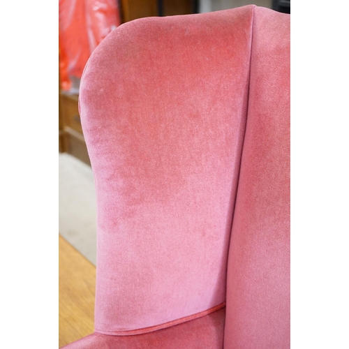 592 - Edwardian Wingback Armchair in the George III manner, upholstered in pink fabric, raised on square l... 