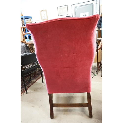 592 - Edwardian Wingback Armchair in the George III manner, upholstered in pink fabric, raised on square l... 