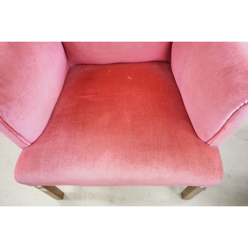 592 - Edwardian Wingback Armchair in the George III manner, upholstered in pink fabric, raised on square l... 