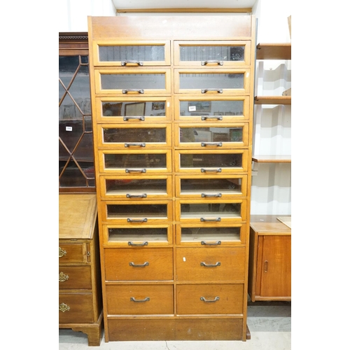 597 - Early 20th century Shop Oak Haberdashery Cabinet with two banks of eight glass fronted drawers (16 t... 