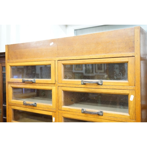 597 - Early 20th century Shop Oak Haberdashery Cabinet with two banks of eight glass fronted drawers (16 t... 