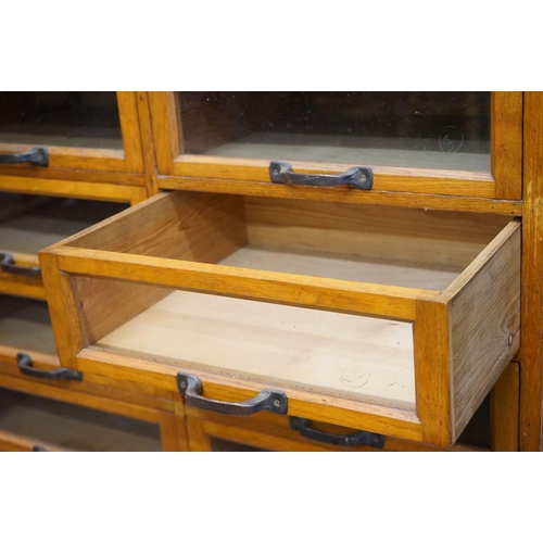 597 - Early 20th century Shop Oak Haberdashery Cabinet with two banks of eight glass fronted drawers (16 t... 