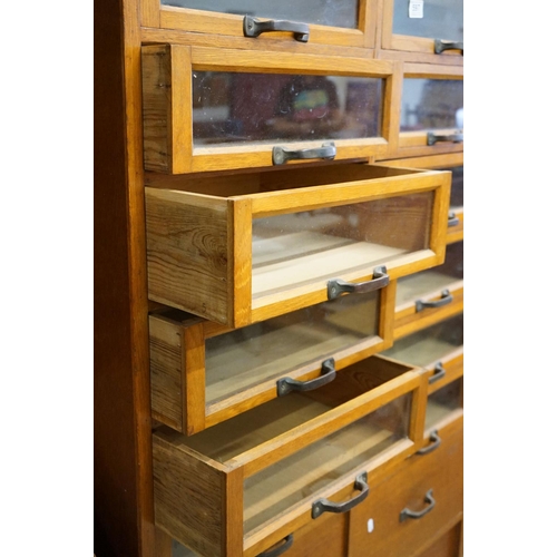 597 - Early 20th century Shop Oak Haberdashery Cabinet with two banks of eight glass fronted drawers (16 t... 