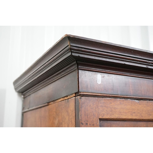 599 - George III Mahogany Linen Press, the upper section later converted to half hanging space and half sh... 