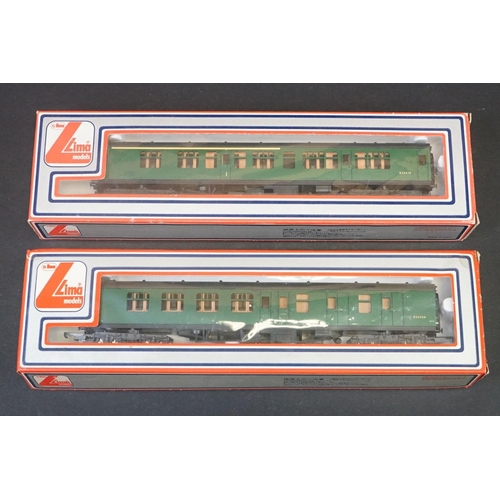 46 - 33 Boxed OO gauge items of rolling stock featuring coaches, wagons and vans to include 29 x Hornby /... 