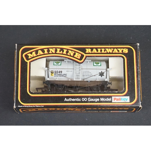 46 - 33 Boxed OO gauge items of rolling stock featuring coaches, wagons and vans to include 29 x Hornby /... 