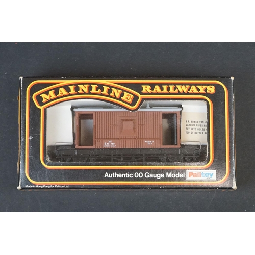 46 - 33 Boxed OO gauge items of rolling stock featuring coaches, wagons and vans to include 29 x Hornby /... 