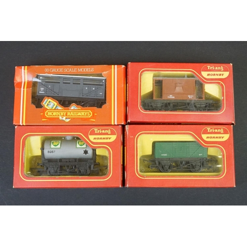 46 - 33 Boxed OO gauge items of rolling stock featuring coaches, wagons and vans to include 29 x Hornby /... 