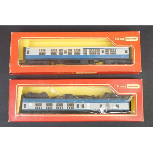 46 - 33 Boxed OO gauge items of rolling stock featuring coaches, wagons and vans to include 29 x Hornby /... 