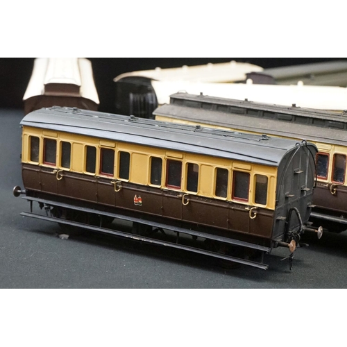 98 - 12 O gauge items of kit built coaches featuring trucks and vans, plastic & metal constructions, over... 