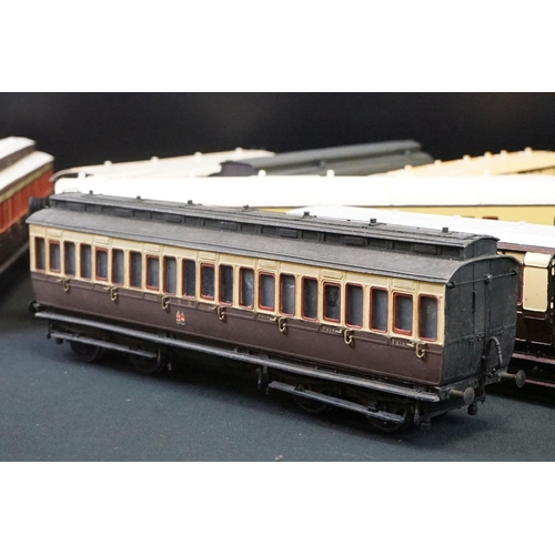 98 - 12 O gauge items of kit built coaches featuring trucks and vans, plastic & metal constructions, over... 