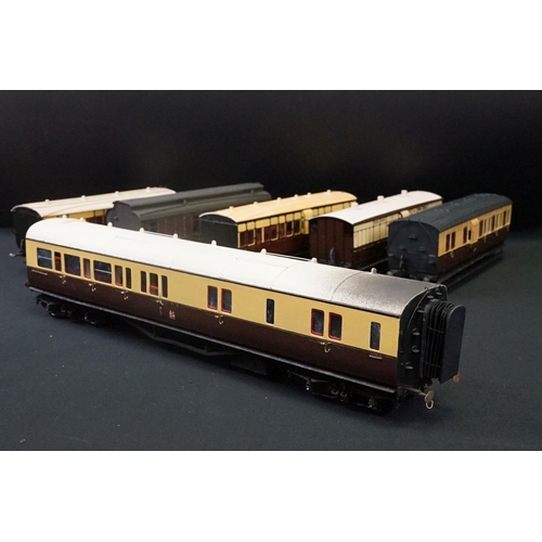 98 - 12 O gauge items of kit built coaches featuring trucks and vans, plastic & metal constructions, over... 