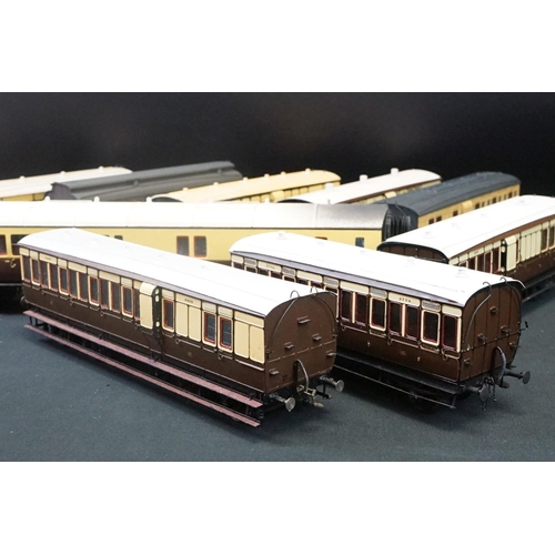 98 - 12 O gauge items of kit built coaches featuring trucks and vans, plastic & metal constructions, over... 