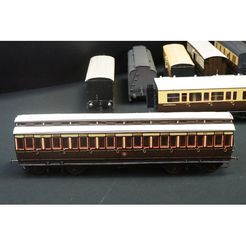 98 - 12 O gauge items of kit built coaches featuring trucks and vans, plastic & metal constructions, over... 