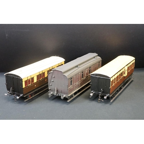 98 - 12 O gauge items of kit built coaches featuring trucks and vans, plastic & metal constructions, over... 