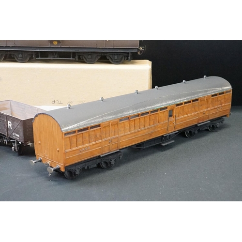 99 - 12 O gauge items of kit built rolling stock featuring trucks, vans and a K4 Dean PBV in brown livery... 