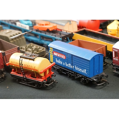 111 - Over 45 OO gauge items of rolling stock to include coaches, car transporter, tankers, vans etc featu... 