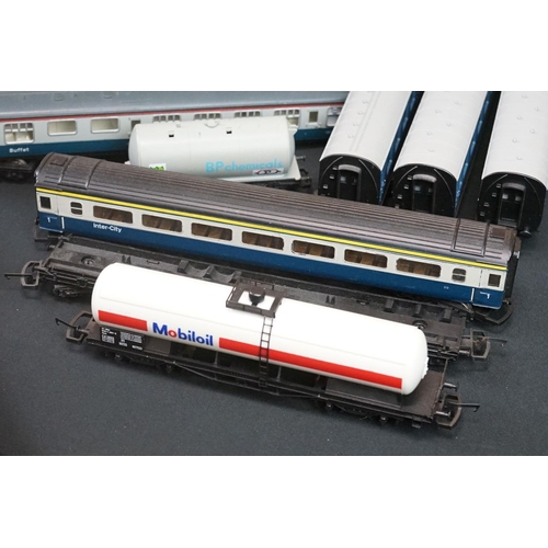 111 - Over 45 OO gauge items of rolling stock to include coaches, car transporter, tankers, vans etc featu... 