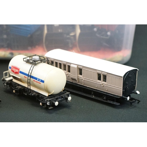 112 - Around 90 OO gauge items of rolling stock featuring tankers, vans and trucks to include Hornby, Tria... 